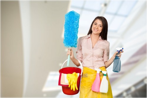 Cleaner wearing PPE while using professional carpet cleaning equipment